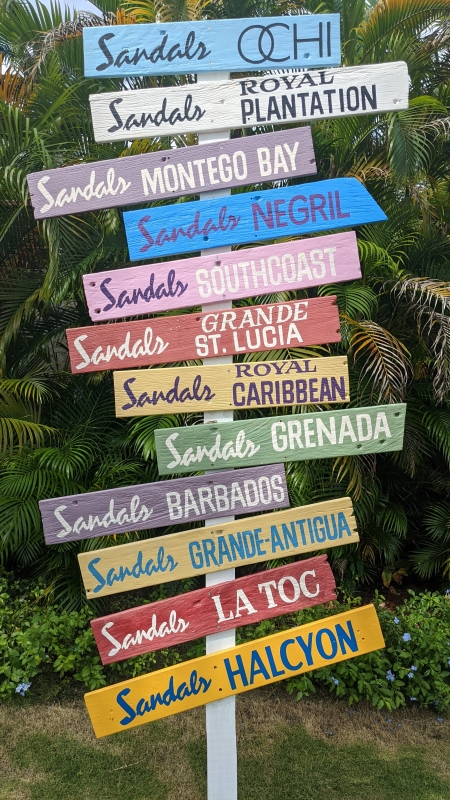 Sandals Caribbean all-inclusive resort sign showing multiple island locations